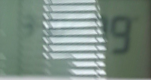 Zoomed-in view of appliance display partially obscured by glare