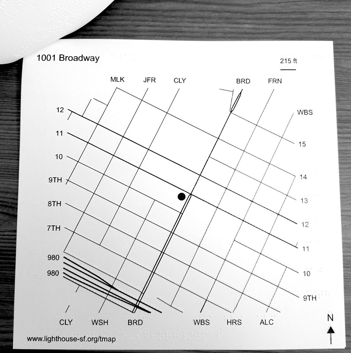 Tactile map featuring braille and low-vision bolded text for a six block radius. Streets and intersections are raised and labeled for use by blind, and viewers with low vision.