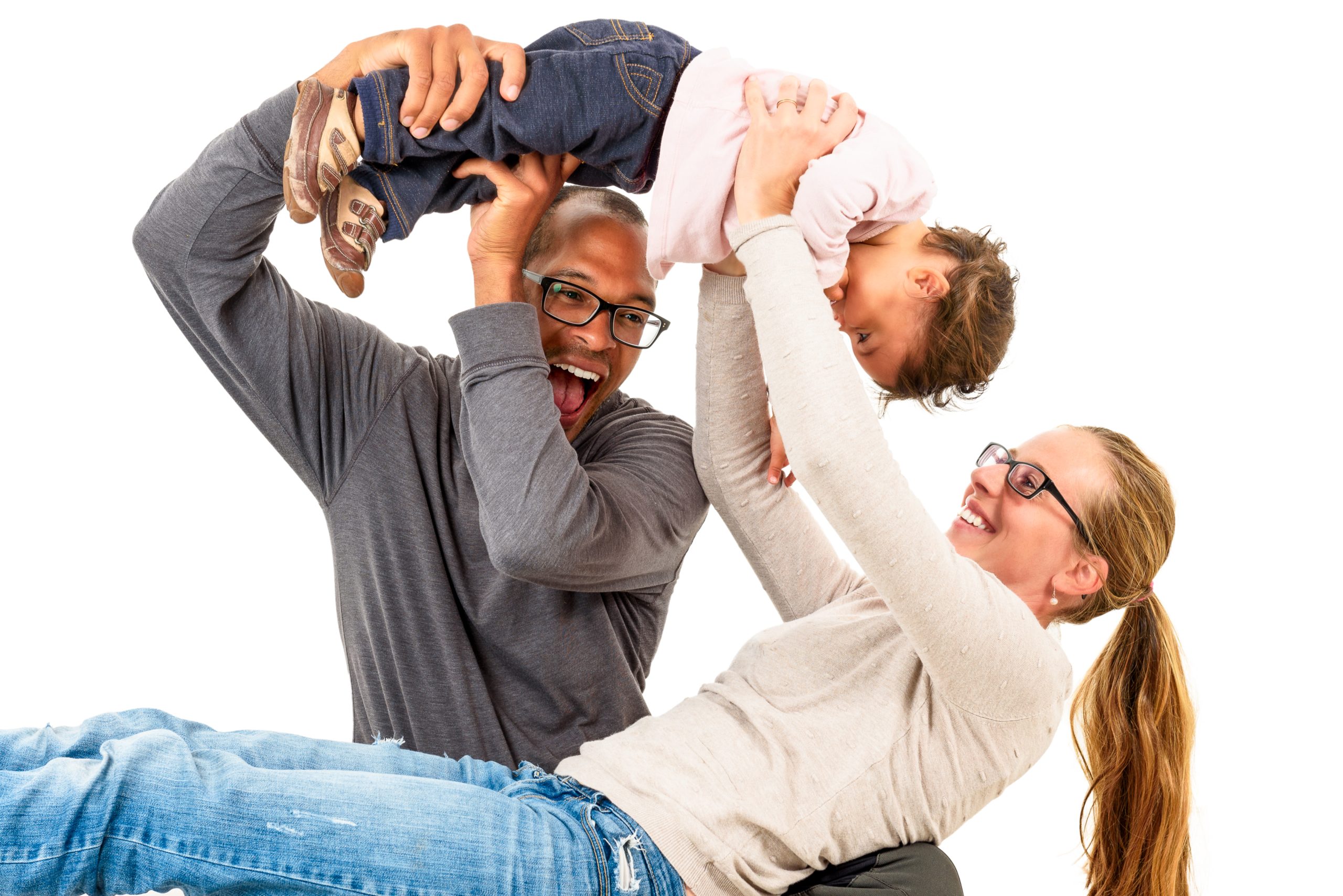 Black father and white mother playing with a child