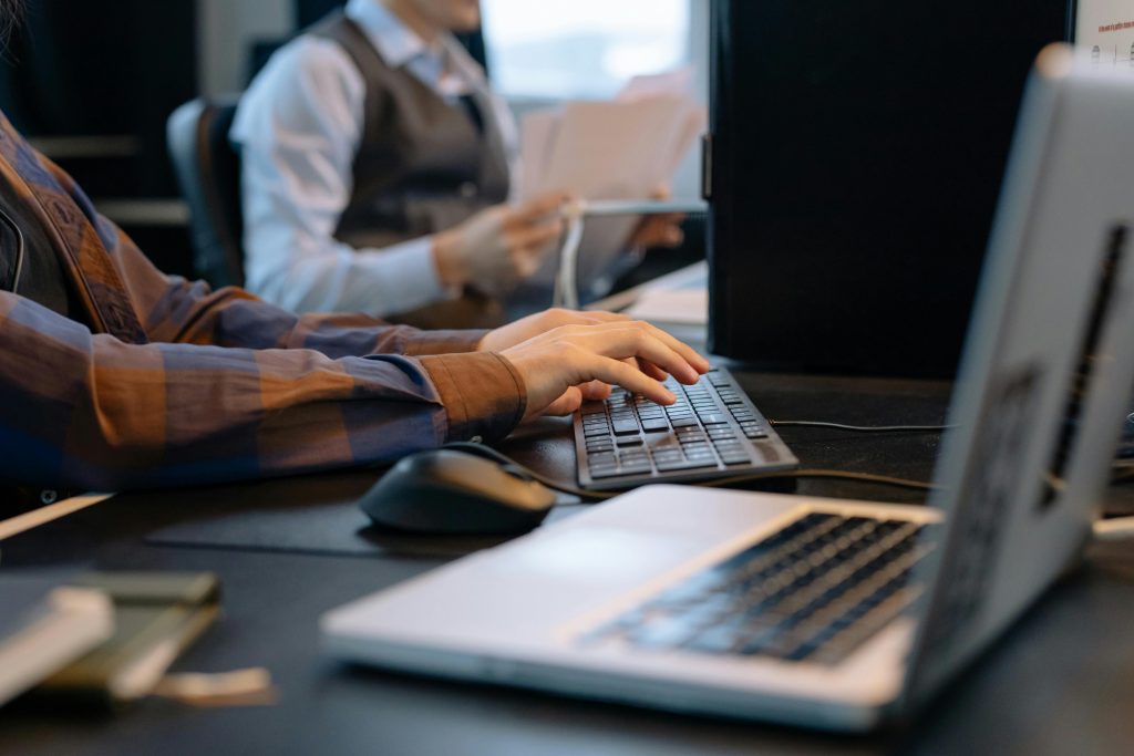 hands tying on a computer keyboard